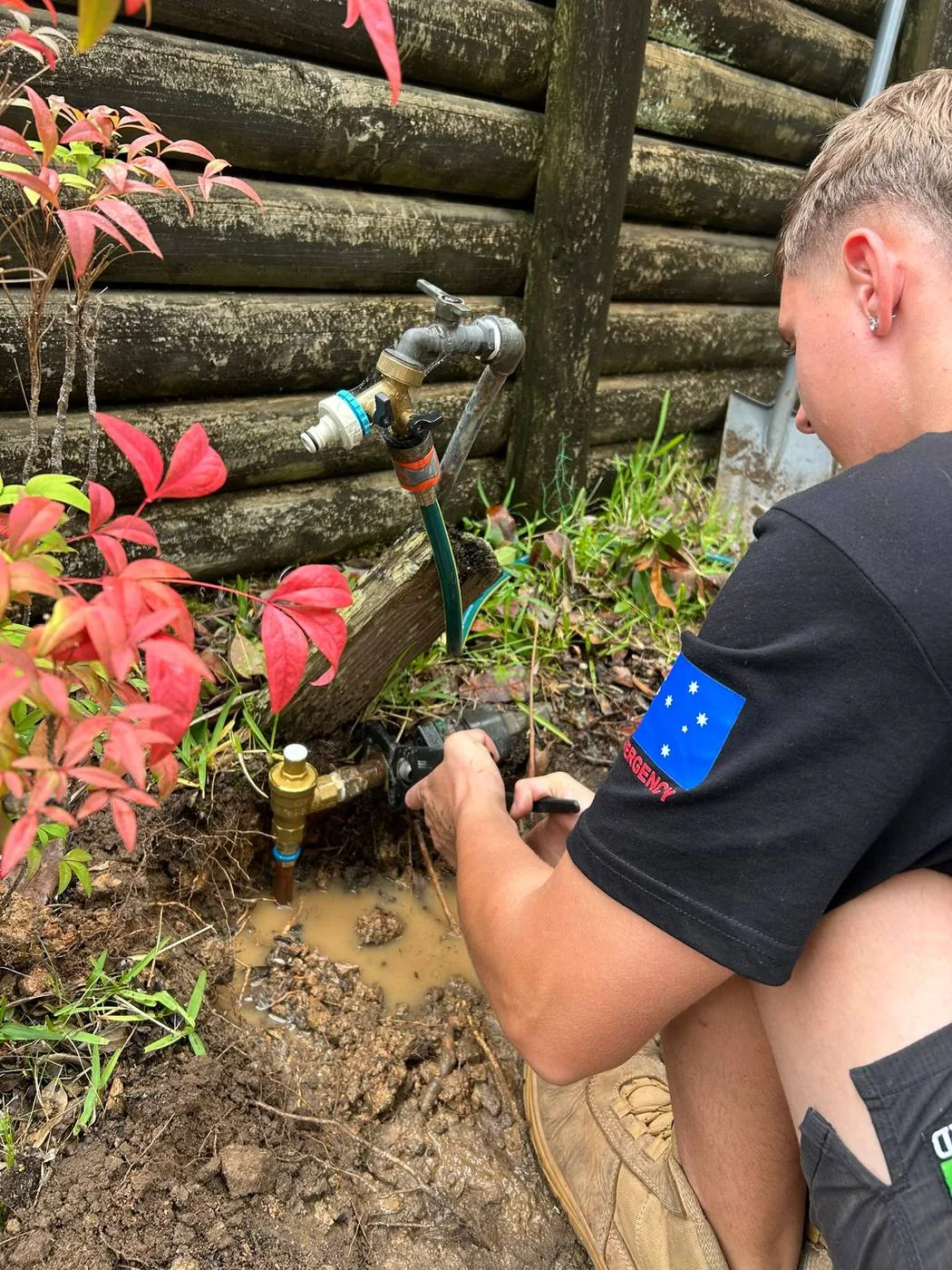 Replacing a garden tap at the base of a fence